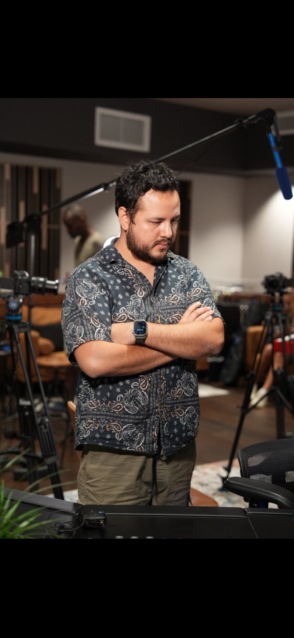 Jason Burgos listening in a recording studio